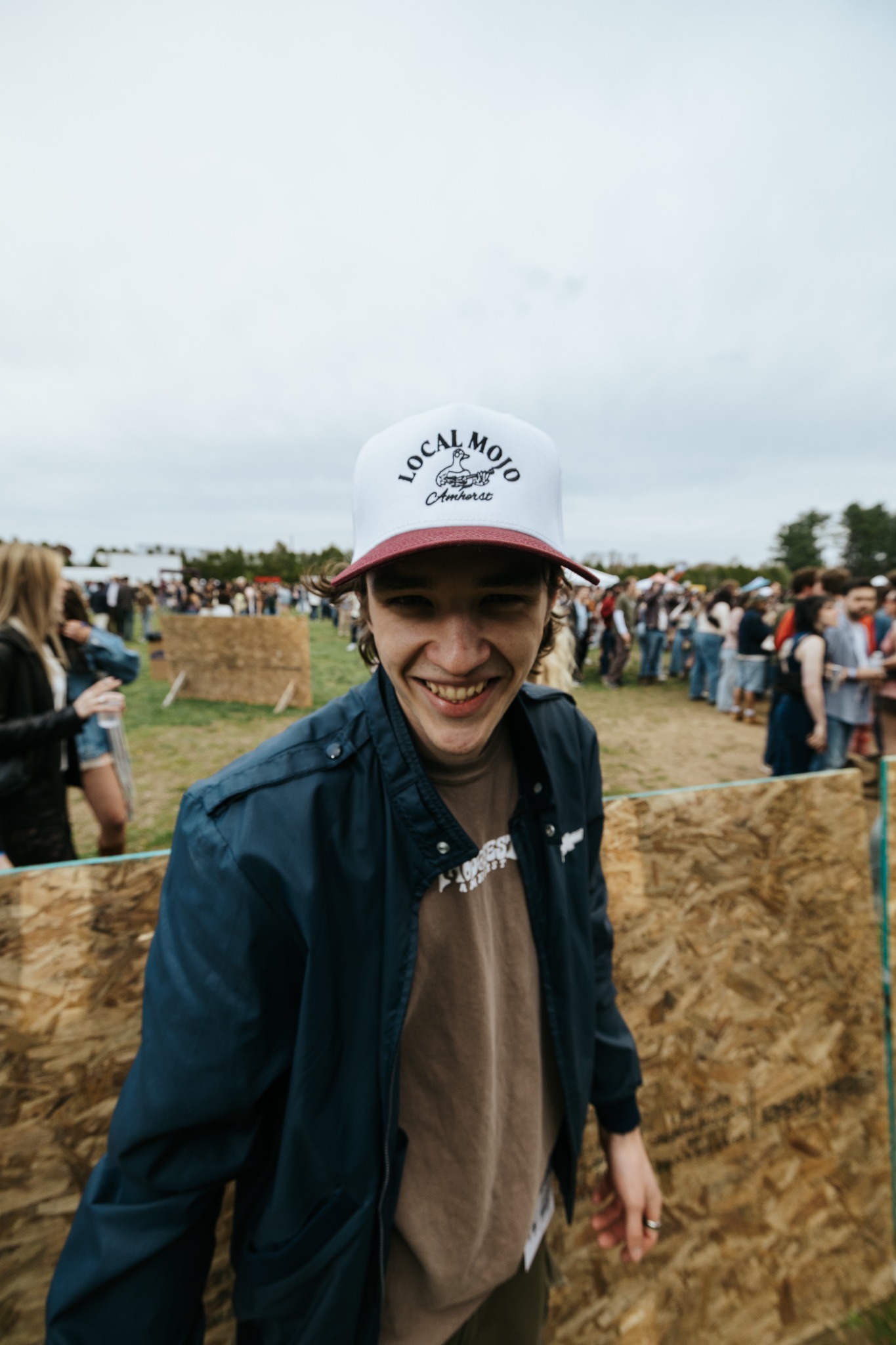 Festivalgoer wearing a Local Mojo Amherst hat