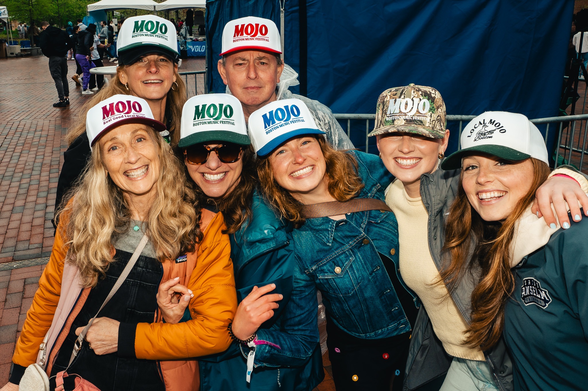 Festivalgoers showing a collection of MOJO hats
